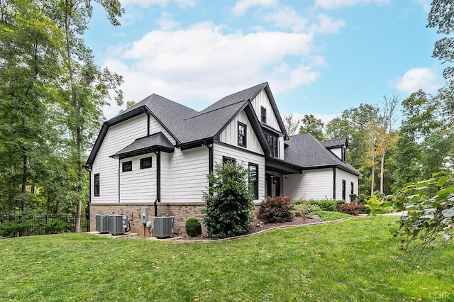 1228 Mill Dam Ln, Forest, VA 24551 - view of side of home with cooling unit, brick siding, and a shingled roof