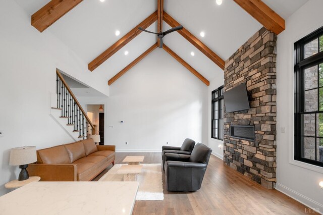 1228 Mill Dam Ln, Forest, VA 24551 - living room featuring beamed ceiling, a fireplace, wood finished floors, stairway, and high vaulted ceiling