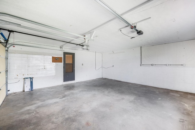 7230 Wards Rd, Rustburg, VA 24588 - garage featuring a garage door opener, concrete block wall, and electric panel