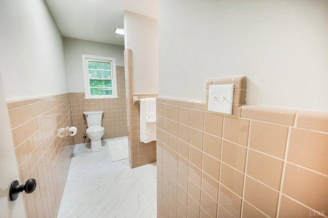 7230 Wards Rd, Rustburg, VA 24588 - bathroom featuring tile walls, toilet, wainscoting, and marble finish flooring