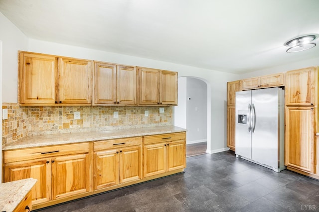7230 Wards Rd, Rustburg, VA 24588 - kitchen featuring stainless steel refrigerator with ice dispenser, arched walkways, tasteful backsplash, and light brown cabinets