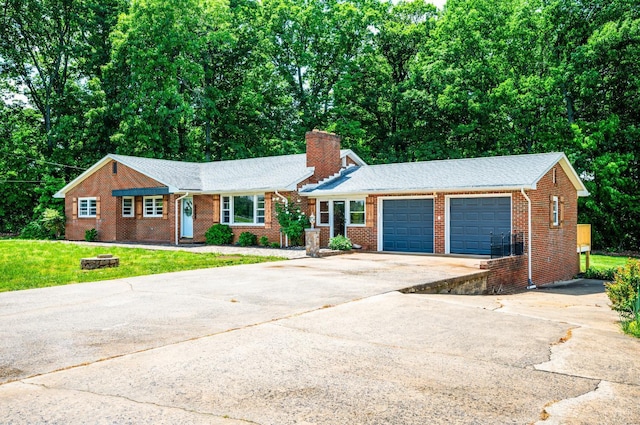 7230 Wards Rd, Rustburg, VA 24588 - ranch-style house featuring driveway, a chimney, an attached garage, brick siding, and a front lawn