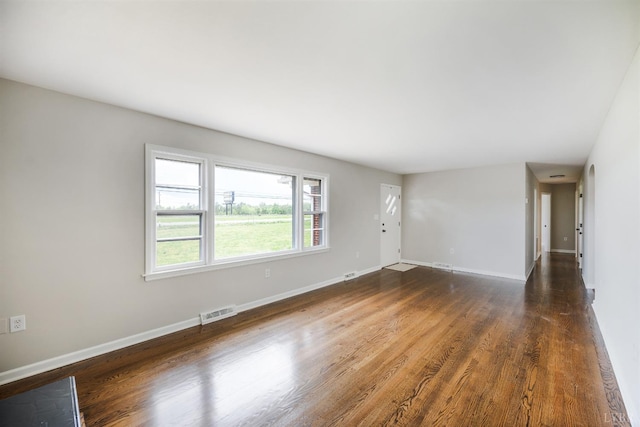 7230 Wards Rd, Rustburg, VA 24588 - unfurnished living room featuring dark wood-style flooring and baseboards