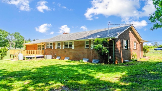 7230 Wards Rd, Rustburg, VA 24588 - rear view of property featuring brick siding, a yard, a chimney, and cooling unit