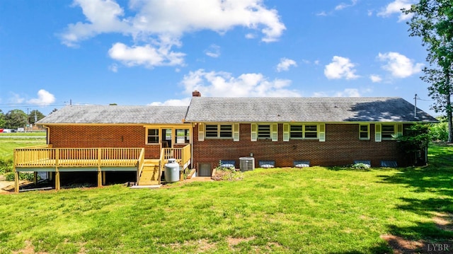 7230 Wards Rd, Rustburg, VA 24588 - back of property featuring central AC unit, a lawn, a deck, and a chimney