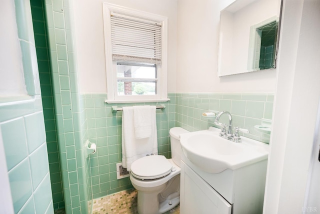 7230 Wards Rd, Rustburg, VA 24588 - bathroom with tile walls, vanity, and a wainscoted wall