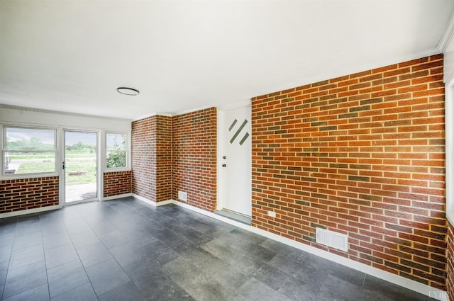 7230 Wards Rd, Rustburg, VA 24588 - empty room featuring brick wall