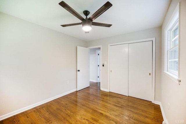 7230 Wards Rd, Rustburg, VA 24588 - unfurnished bedroom featuring wood finished floors, baseboards, and a closet