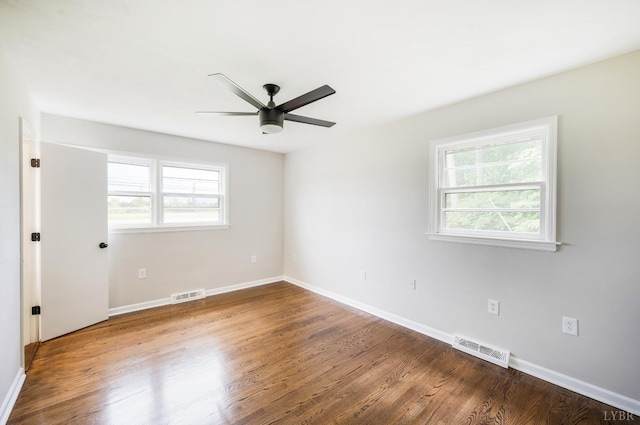 7230 Wards Rd, Rustburg, VA 24588 - empty room featuring healthy amount of natural light, a ceiling fan, wood finished floors, and baseboards