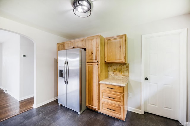 7230 Wards Rd, Rustburg, VA 24588 - kitchen featuring stainless steel fridge with ice dispenser, arched walkways, light brown cabinets, decorative backsplash, and baseboards
