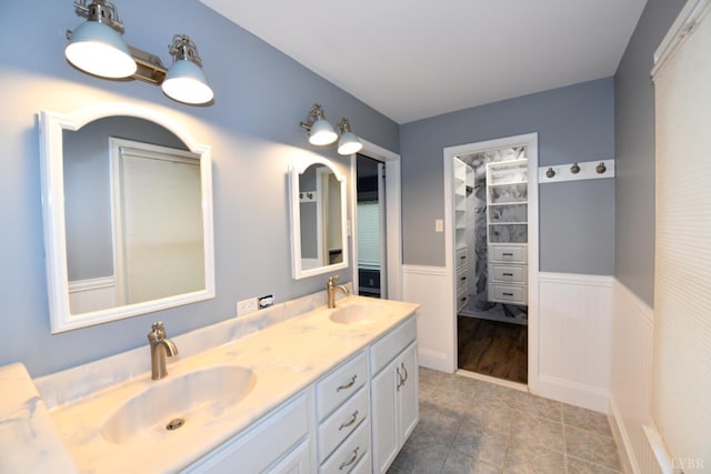 2130 Burnt Bridge Rd, Lynchburg, VA 24503 - bathroom featuring double vanity, wainscoting, and tile patterned flooring