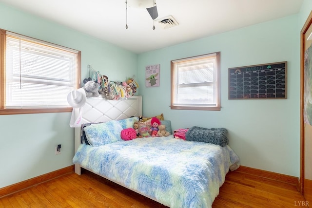 4100 Roark Mill Rd, Hurt, VA 24563 - bedroom with wood finished floors and a ceiling fan