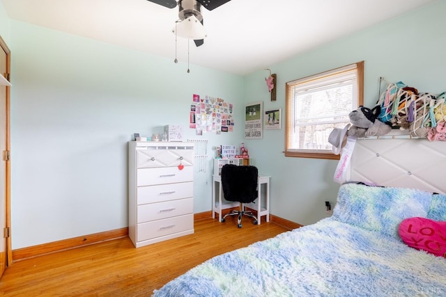 4100 Roark Mill Rd, Hurt, VA 24563 - bedroom with wood finished floors and ceiling fan