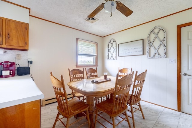 4100 Roark Mill Rd, Hurt, VA 24563 - dining space featuring ornamental molding, ceiling fan, light marble finish floors, a baseboard radiator, and a textured ceiling