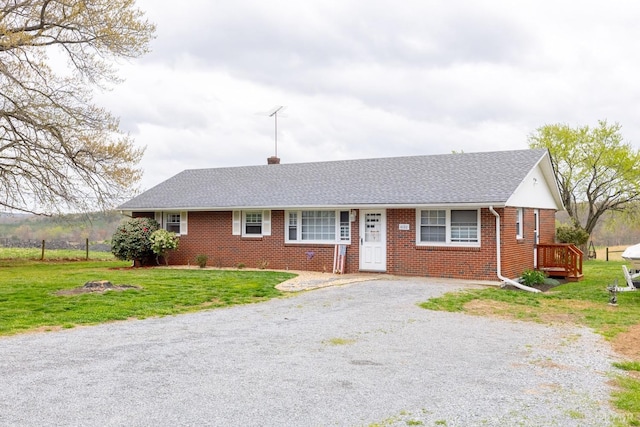 4100 Roark Mill Rd, Hurt, VA 24563 - ranch-style house featuring brick siding, a front lawn, driveway, a shingled roof, and a chimney