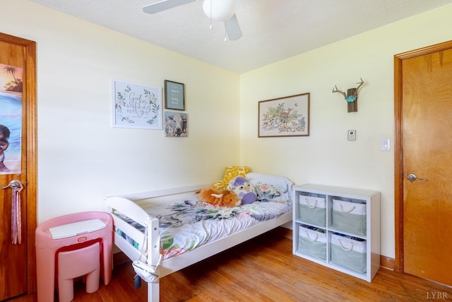 4100 Roark Mill Rd, Hurt, VA 24563 - bedroom with wood finished floors and a ceiling fan