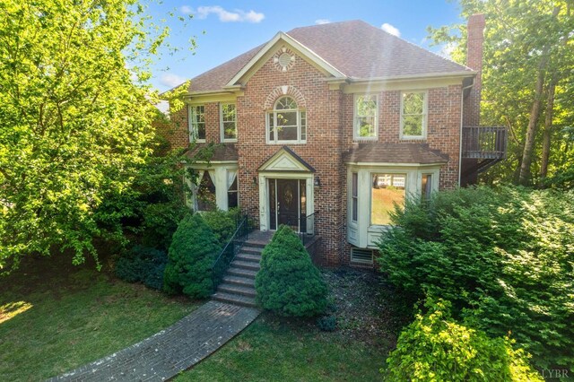 1068 Huckleberry Ln, Lynchburg, VA 24503 - colonial house with a chimney, brick siding, and a shingled roof