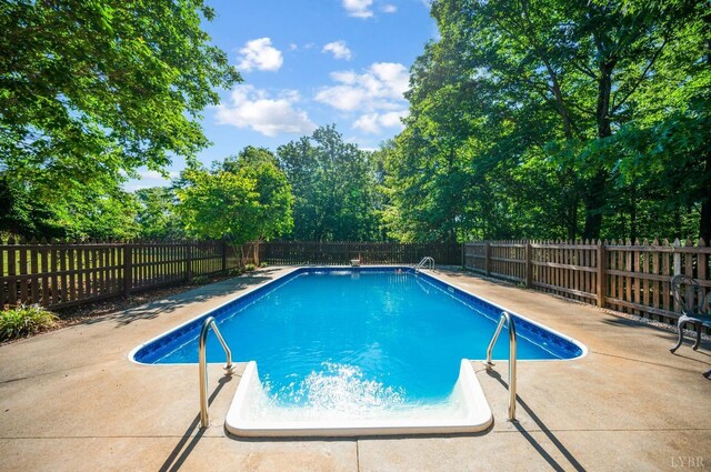 1068 Huckleberry Ln, Lynchburg, VA 24503 - view of swimming pool with a fenced backyard, a patio area, and view of scattered trees