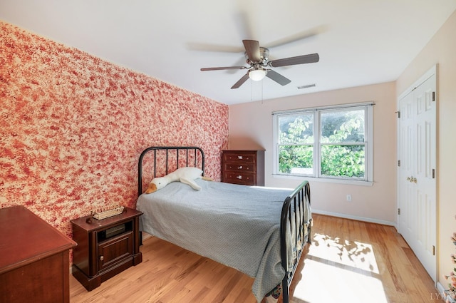 1068 Huckleberry Ln, Lynchburg, VA 24503 - bedroom with light wood-style flooring, baseboards, an accent wall, and ceiling fan