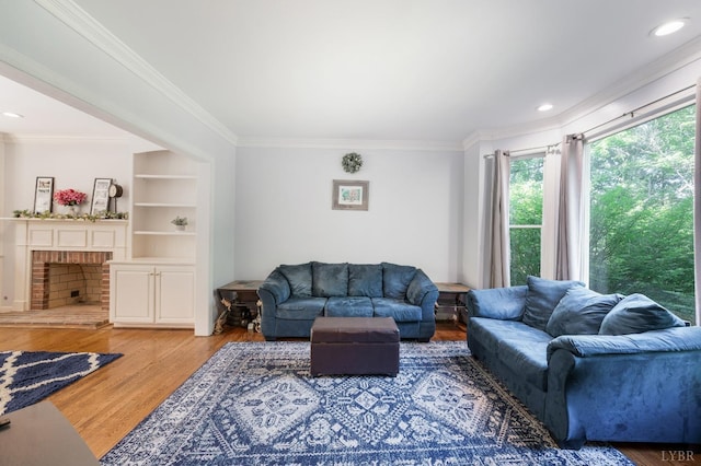 1068 Huckleberry Ln, Lynchburg, VA 24503 - living room featuring healthy amount of natural light, crown molding, wood finished floors, a fireplace, and recessed lighting