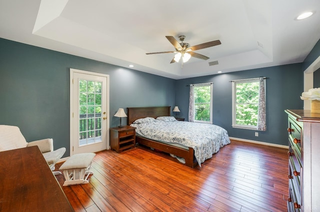 1068 Huckleberry Ln, Lynchburg, VA 24503 - bedroom featuring a raised ceiling, access to exterior, hardwood / wood-style flooring, and a ceiling fan