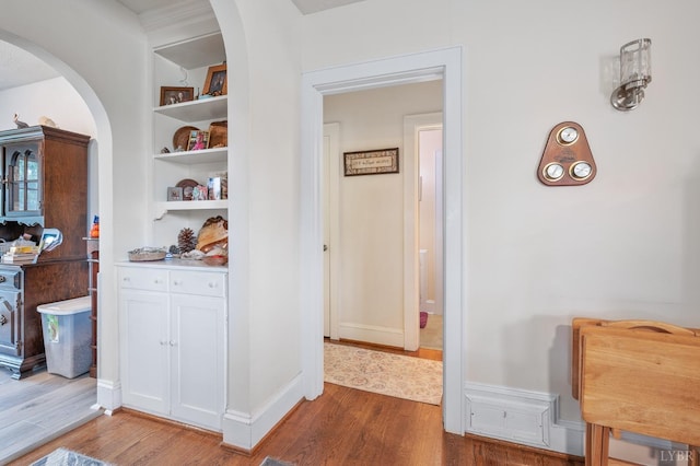500 Leftwich St, Gretna, VA 24557 - hallway featuring arched walkways, wood finished floors, and built in features