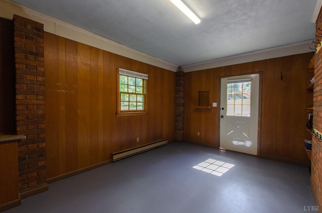 1426 Nelson Dr, Lynchburg, VA 24502 - empty room featuring a baseboard heating unit, wood walls, ornamental molding, finished concrete floors, and a fireplace