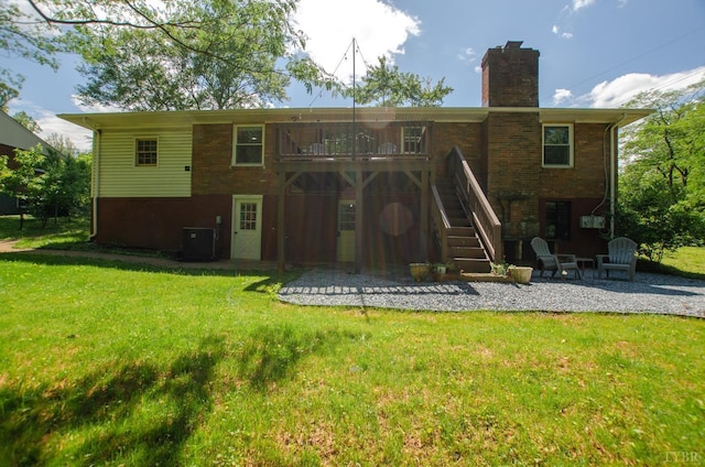 1426 Nelson Dr, Lynchburg, VA 24502 - back of house featuring a patio area, a lawn, stairs, a chimney, and a wooden deck