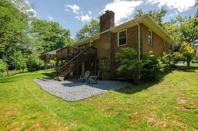 1426 Nelson Dr, Lynchburg, VA 24502 - rear view of house featuring a patio area, a wooden deck, a chimney, brick siding, and a lawn