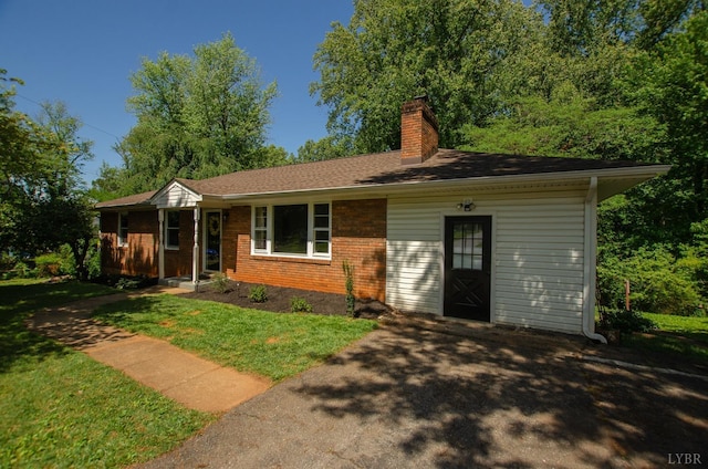 1426 Nelson Dr, Lynchburg, VA 24502 - ranch-style house with a chimney, brick siding, and a front yard