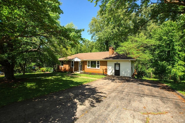 1426 Nelson Dr, Lynchburg, VA 24502 - ranch-style home with a chimney, asphalt driveway, a front lawn, and brick siding