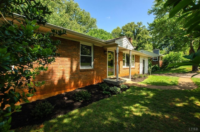 1426 Nelson Dr, Lynchburg, VA 24502 - view of home's exterior with brick siding and a yard