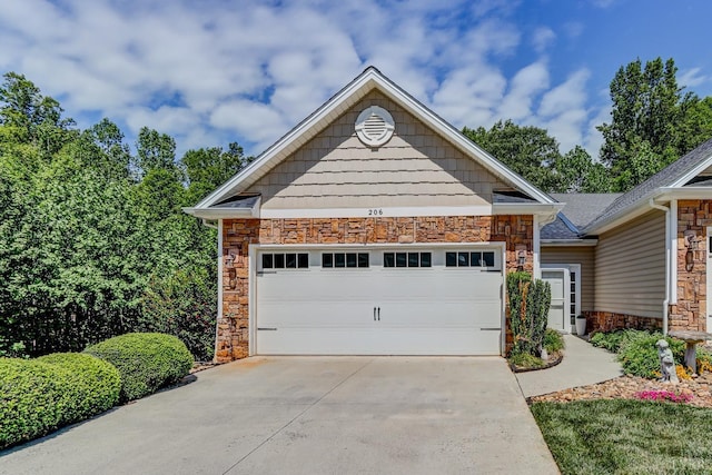 206 Bella Ct, Lynchburg, VA 24502 - view of front of home with stone siding, concrete driveway, and a garage