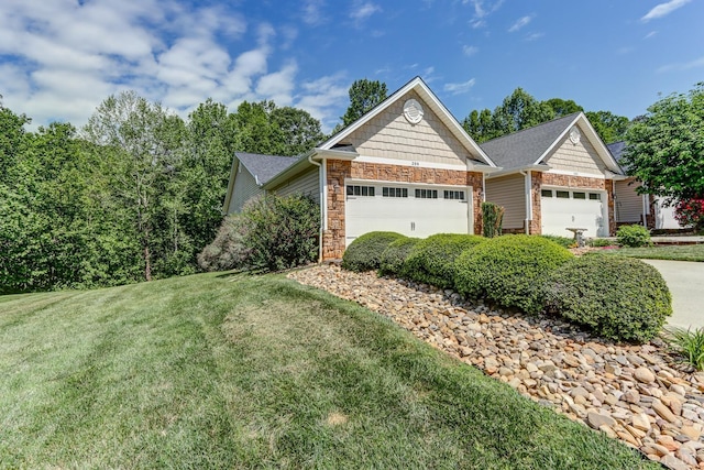 206 Bella Ct, Lynchburg, VA 24502 - view of front of property featuring an attached garage, stone siding, a front yard, and concrete driveway