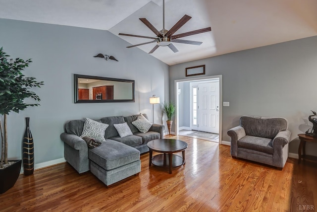 206 Bella Ct, Lynchburg, VA 24502 - living area featuring vaulted ceiling, ceiling fan, wood finished floors, and baseboards