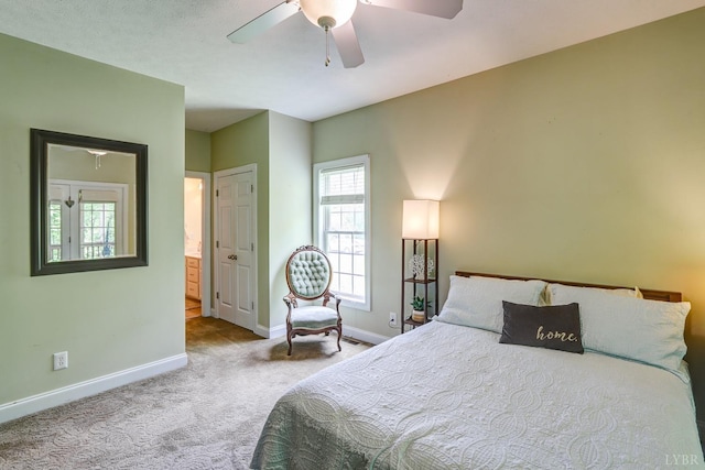 206 Bella Ct, Lynchburg, VA 24502 - carpeted bedroom featuring baseboards, multiple windows, ceiling fan, and ensuite bathroom