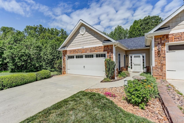 206 Bella Ct, Lynchburg, VA 24502 - view of front facade with stone siding, a garage, and driveway