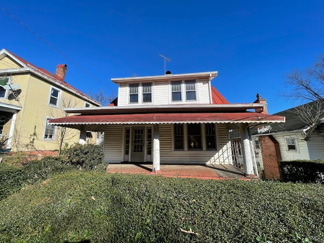 rear view of house featuring a patio area