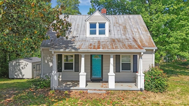 1131 Tabor Rd, Gladys, VA 24554 - view of front of home featuring a chimney, a porch, metal roof, and a standing seam roof