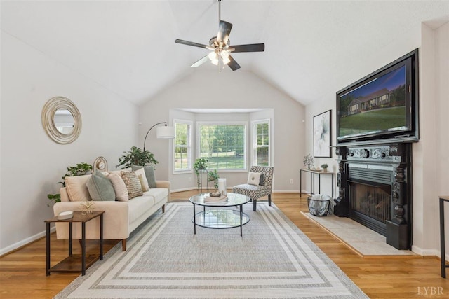 112 Cedarwood Ct, Forest, VA 24551 - living room featuring ceiling fan, wood finished floors, lofted ceiling, a fireplace with flush hearth, and baseboards