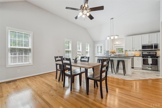 112 Cedarwood Ct, Forest, VA 24551 - dining space with healthy amount of natural light, light wood-style flooring, ceiling fan, baseboards, and high vaulted ceiling