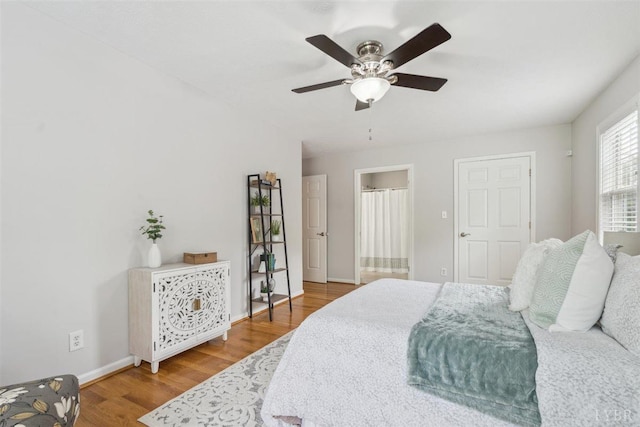 112 Cedarwood Ct, Forest, VA 24551 - bedroom featuring wood finished floors, baseboards, ceiling fan, and connected bathroom