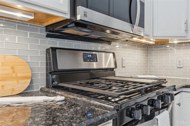 112 Cedarwood Ct, Forest, VA 24551 - kitchen with appliances with stainless steel finishes, decorative backsplash, white cabinetry, and dark stone countertops