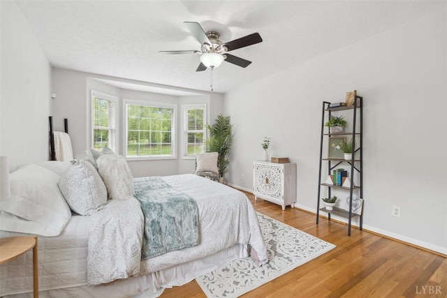 112 Cedarwood Ct, Forest, VA 24551 - bedroom with wood finished floors, baseboards, and ceiling fan