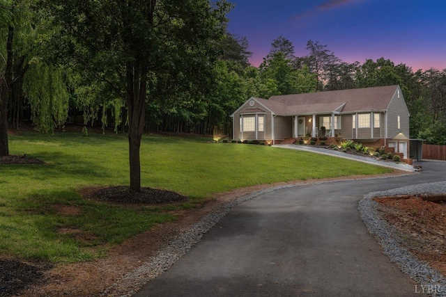 112 Cedarwood Ct, Forest, VA 24551 - ranch-style home with asphalt driveway, a front lawn, and a porch