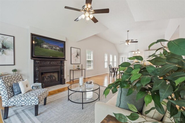 112 Cedarwood Ct, Forest, VA 24551 - living room featuring a ceiling fan, wood finished floors, a fireplace, lofted ceiling, and baseboards