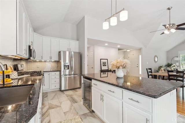 112 Cedarwood Ct, Forest, VA 24551 - kitchen with appliances with stainless steel finishes, lofted ceiling, beverage cooler, ceiling fan, and decorative backsplash