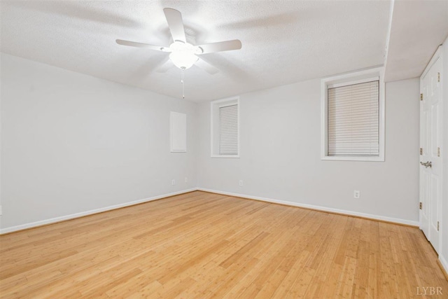 112 Cedarwood Ct, Forest, VA 24551 - spare room with light wood-type flooring, baseboards, a ceiling fan, and a textured ceiling