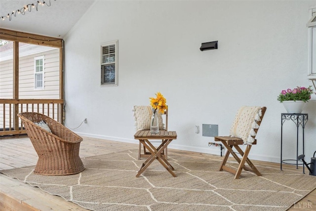 112 Cedarwood Ct, Forest, VA 24551 - sitting room with wood finished floors, baseboards, and lofted ceiling