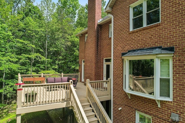 4936 Mountain Laurel Dr, Lynchburg, VA 24503 - view of side of home featuring brick siding, a deck, outdoor lounge area, a chimney, and stairway